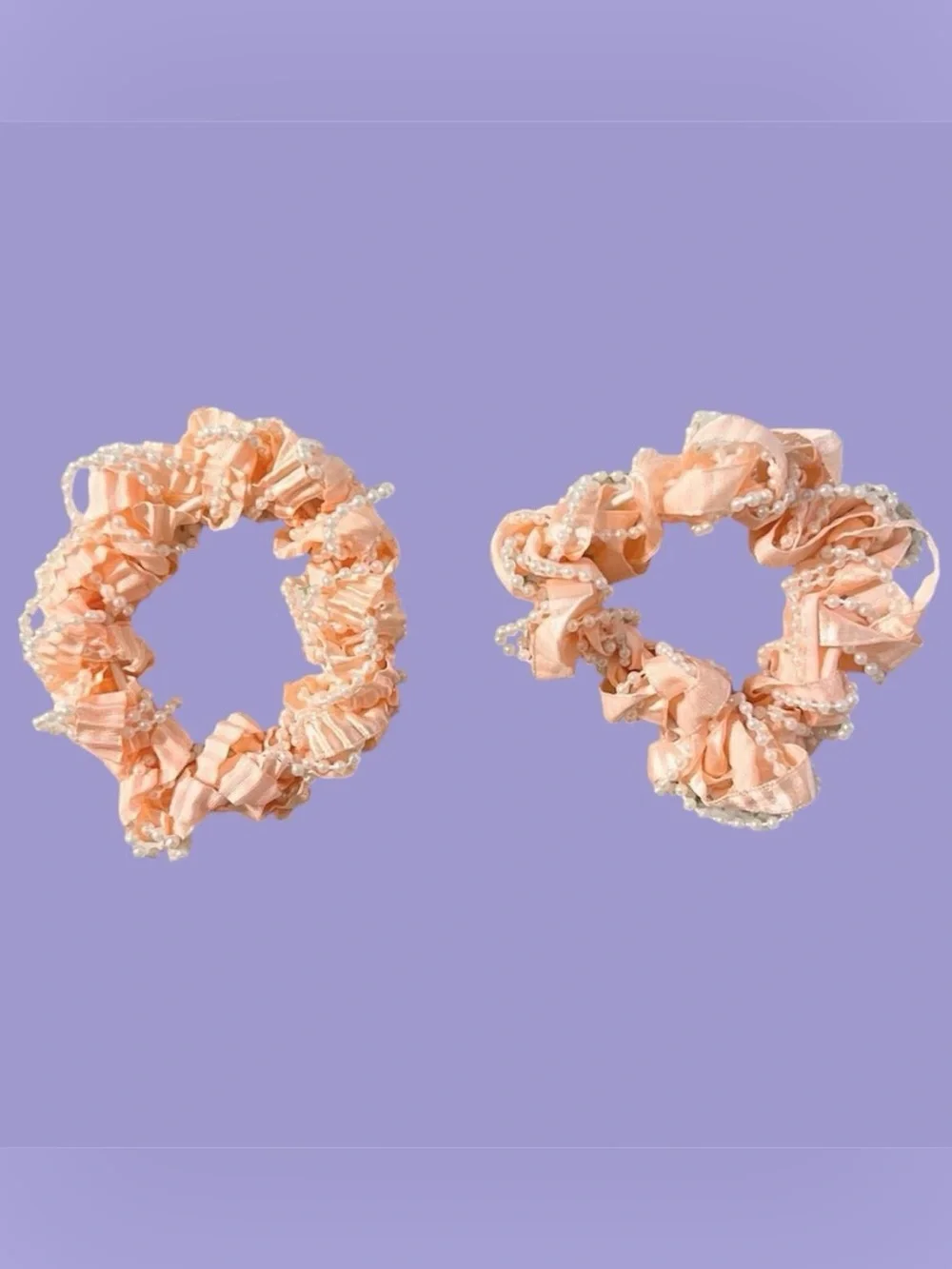 Peach colored scrunchies set.